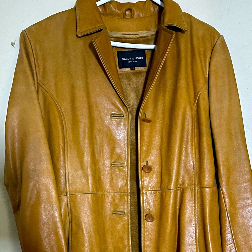 3 quarter length Leather Button Down Coat… With inside layer that zips off..